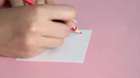 Woman's hand writes - I love you Stock Footage 1087471
