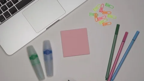 Womans hand writing LESSON 2 on notepad Stock Footage 100113737