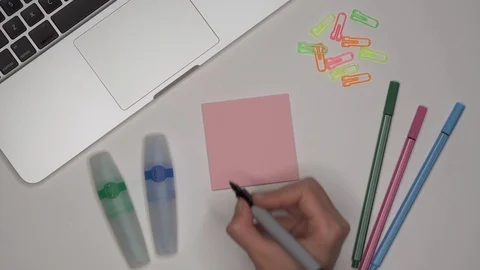 Womans hand writing MATHS on notepad Stock Footage 100115835