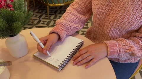 Womans hand writing in notebook goals list. Stock Footage 258598281