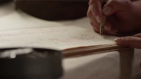 A woman's hand is writing in a notebook. Writing with a pen Video stock 199036500