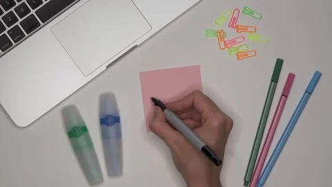 Womans hand writing PHYSICS on notepad Stock Footage 100115877