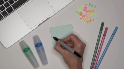 Womans hand writing WEBSITE on notepad Stock Footage 102212976