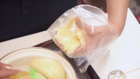 Woman's hands adding the dough to the pastry bag Stock Footage 74467118