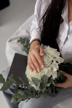 Woman's hands and hydrangea, close up view Stock Photos