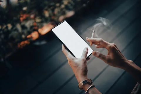 Woman's hands and smartphone with cigarettes. Stock Footage 156338556