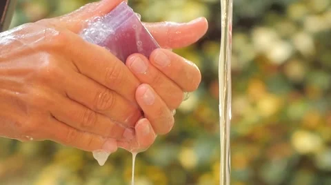 Woman's hands and violet soap close up slow motion Video stock 41389933