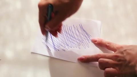Woman's hands angrily scribbling on white paper Video stock 319887405