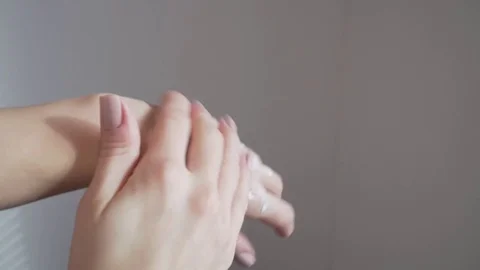 Woman's hands applying cream Stock Footage 85141122