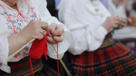 Woman's hands are knitting clothes of wool Stock Footage 87260269
