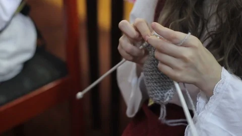 Woman's hands are knitting clothes of wool Stock Footage 87262819