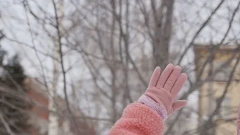 The woman's hands are raised up. Hands in pink gloves on the background of Stock Footage 149060903