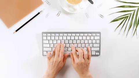 Woman's hands are typing on a computer keyboard, office flatlay workspace. Stock Footage 116882064