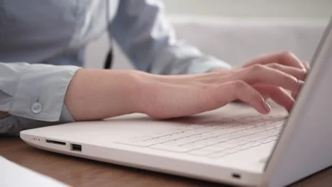 A woman's hands are typing on her laptop. Stock Footage 178985760