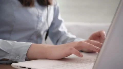 A woman's hands are typing on her laptop. Stock Footage 182020424