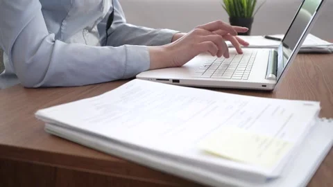 A woman's hands are typing on her laptop. Stock Footage 182023526