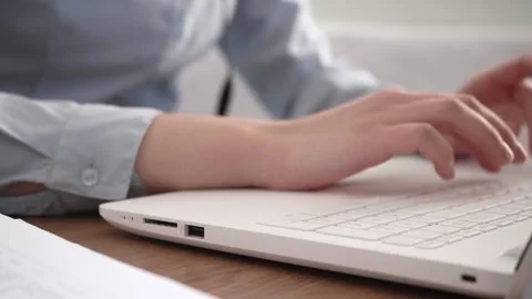 A woman's hands are typing on her laptop. Stock Footage 182034425