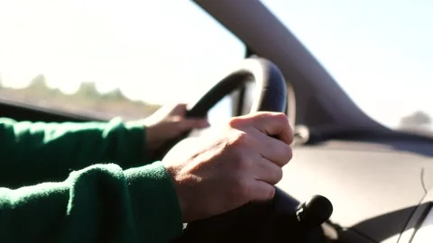 Woman's hands behind the wheel of a car Stock Footage 262962953
