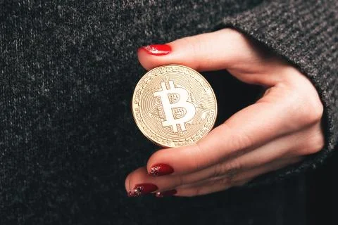 Woman's hands with bitcoin Stock Photos