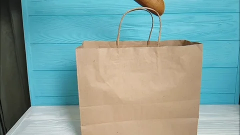 Woman's hands bread package paper Stock Footage 86693872
