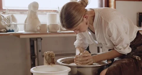 Woman's hands, ceramist in process of modeling handcrafted clayware Stock Footage 208076718