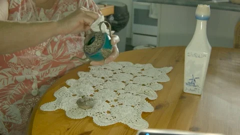 Womans hands clean small antique ornamental teapot. Color corrected version. Stock Footage 72701168