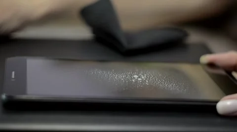 Woman's Hands Cleaning Tablet Pc With Spray Stock Footage 55794803