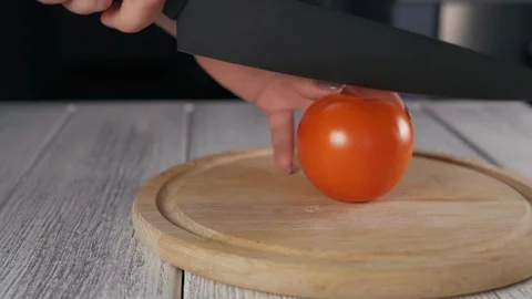 Woman's Hands Close-Up Sliced Tomato On Kitchen Board Stock Footage 103638521