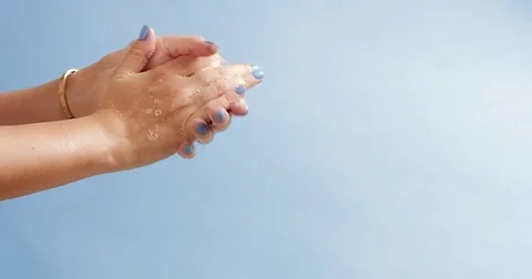 Woman's hands closeup isolated on light blue Video stock 80827048