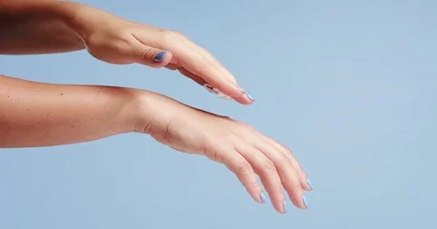 Woman's hands closeup isolated on light blue Video stock 80827274