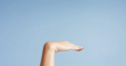 Woman's hands closeup isolated on light blue Stock Footage 80827318
