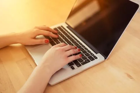 Woman's hands on a computer keyboard Stock Photos