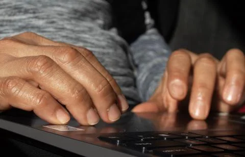 A woman's hands on a computer Stock Photos