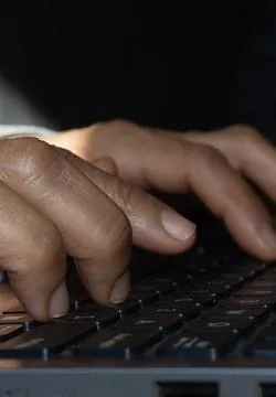 A woman's hands on a computer Stock Photos