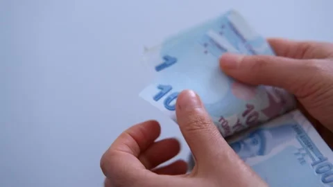 Womans hands counting 100 bills of folded Turkish lira Stock Footage 146576850