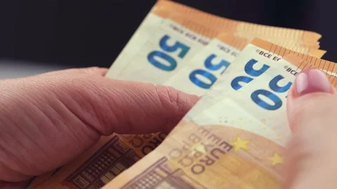 Woman's hands counting euro banknotes or paying in cash against money. Stock Footage 200216586