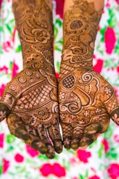 Woman's hands covered in Henna tattoos Stock Photos