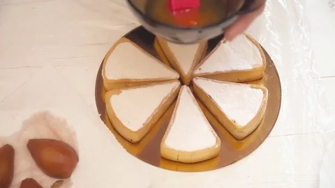 Woman's hands covering the pears with the syrup Stock Footage 74473584