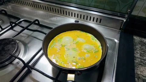 Woman's hands cracking an egg into a bowl for breakfast Stock Footage 335592321