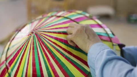 Womans hands create a traditional Vietnamese hat. Craftswoman deftly wields Stock Footage 322045386