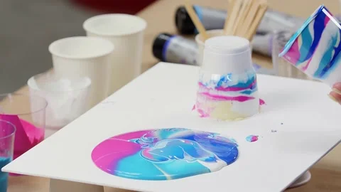 Woman's hands creates modern art. Spilled paint. Drawing concept. Stock Footage 195303222