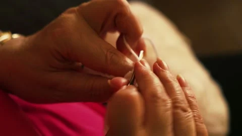 Woman's hands crocheting white yarn top view. Stock Footage 345514689