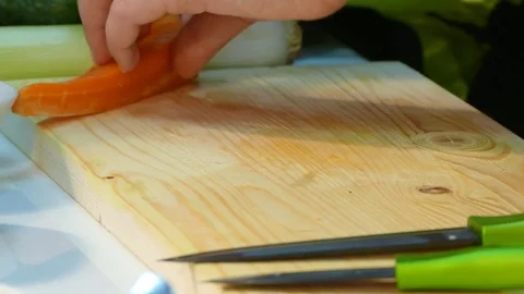 Woman's hands cut into carrots Stock Footage 78489540