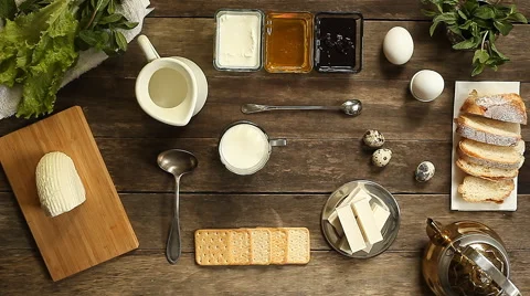 Woman's hands cut the mozzarella cheese on a wooden table. Stock Footage 62561423