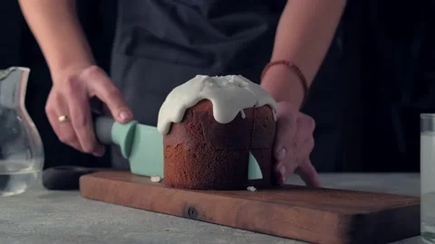 Woman's hands cuts Easter cake with a knife. Happy Easter Video stock 139113692