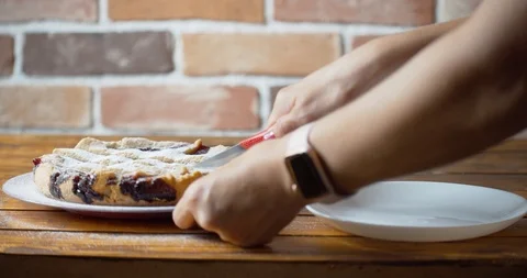 Woman's hands is cutting bilberries pie Stock Footage 115783005