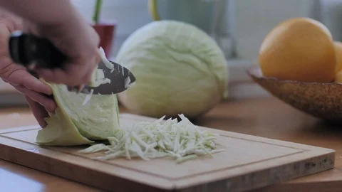 Woman's hands cutting cabbage Stock Footage 96181743