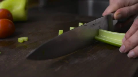 Woman's hands cutting celery Stock Footage 57238460
