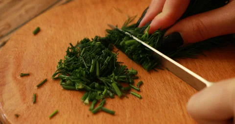Woman's hands cutting dill Video stock 244073595