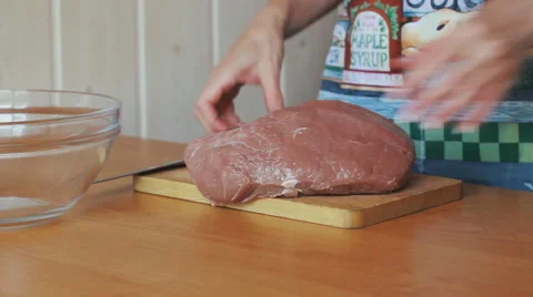 Woman's hands cutting meat Stock Footage 53799198